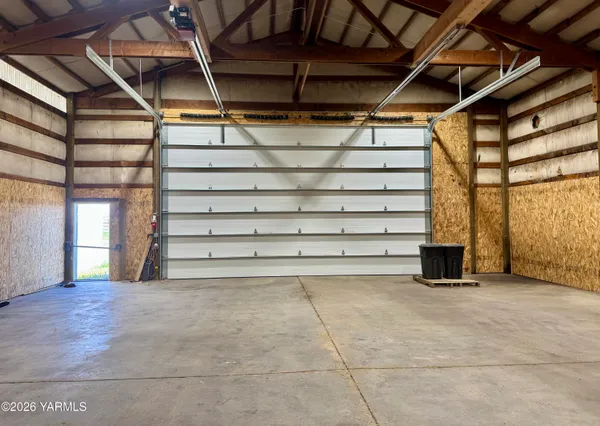 a view of an empty room with a fireplace