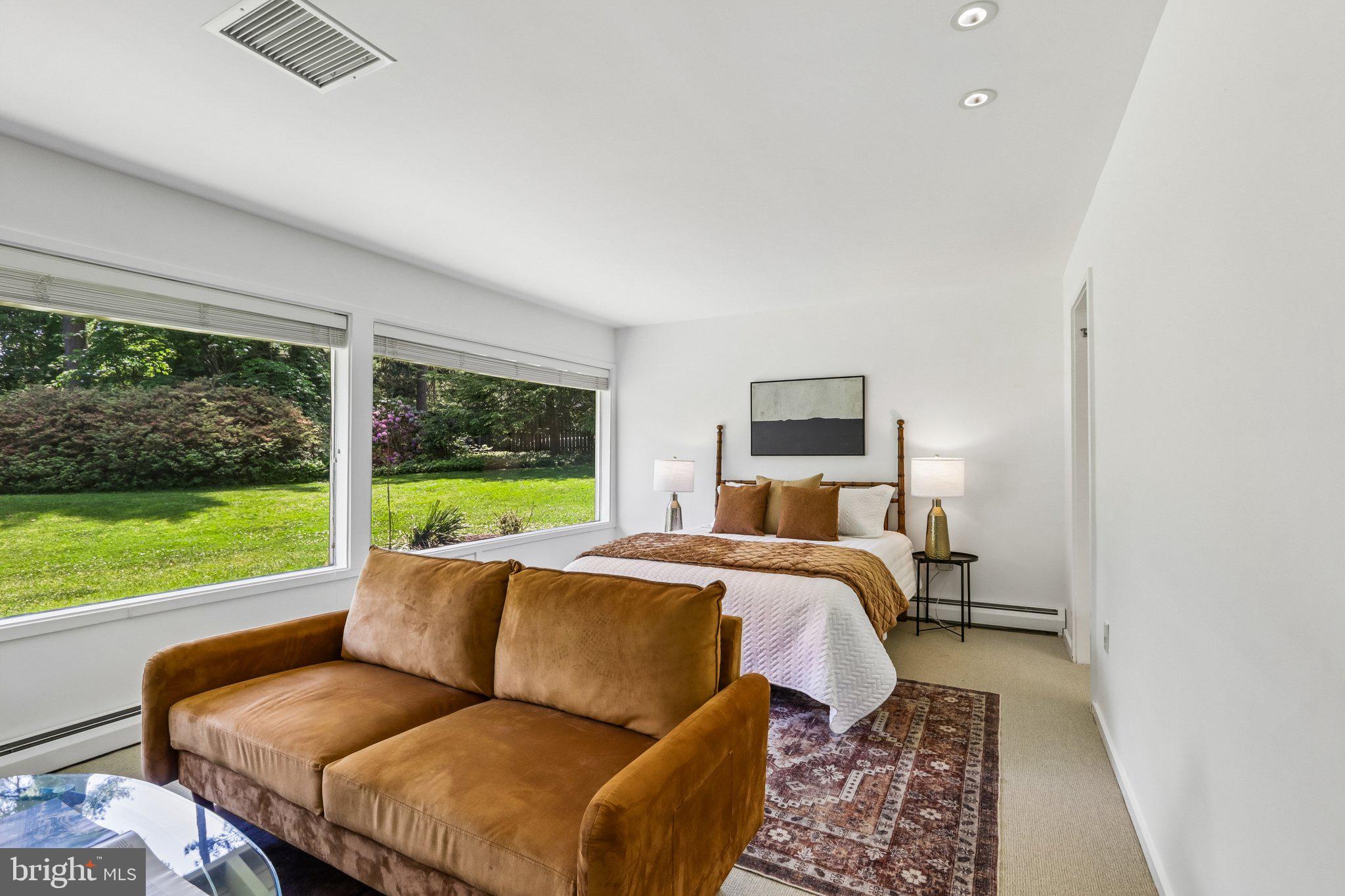 1673 Paper Mill Road Jenkintown, PA 19046 - Photo 31 of 73 a bed room with a bed and a couch