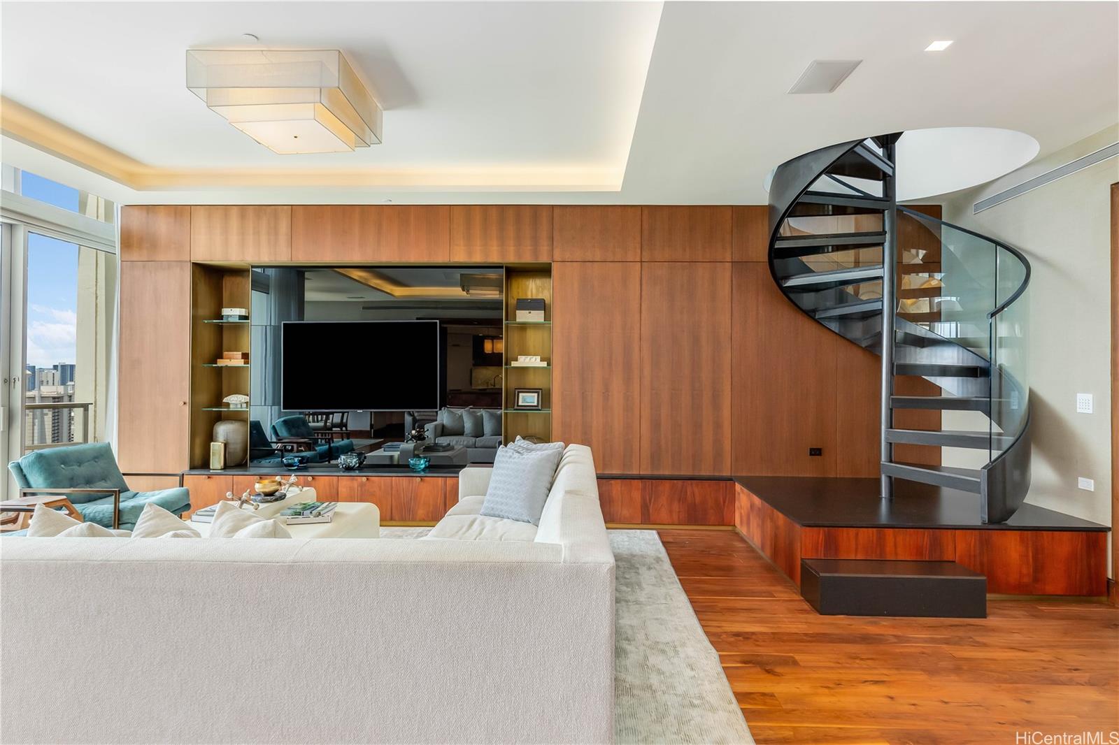 a living room with furniture and a flat screen tv