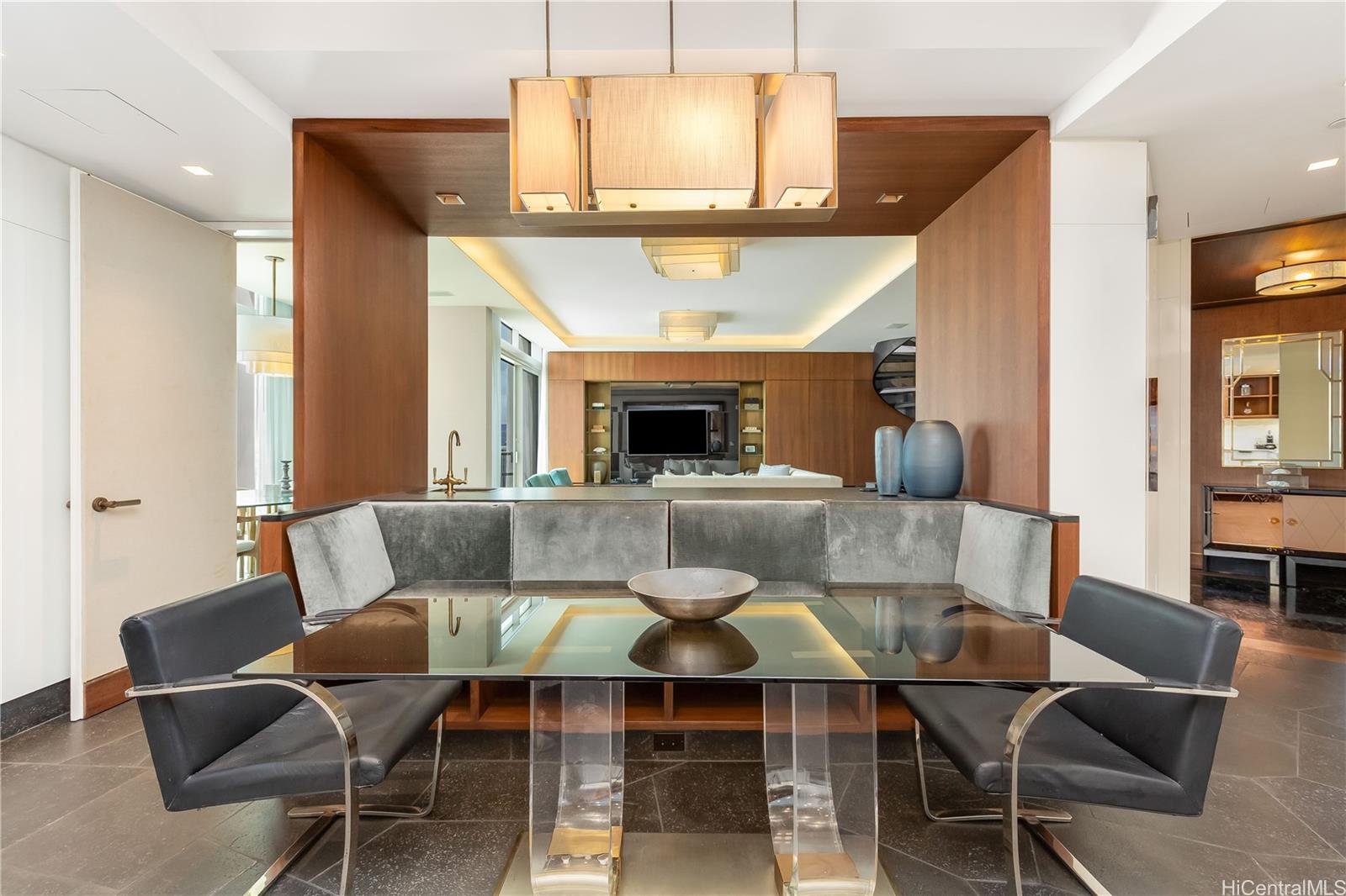 223 Saratoga Road, Unit PHD Honolulu, HI 96815 - Photo 11 of 25 a living room with furniture and a fireplace