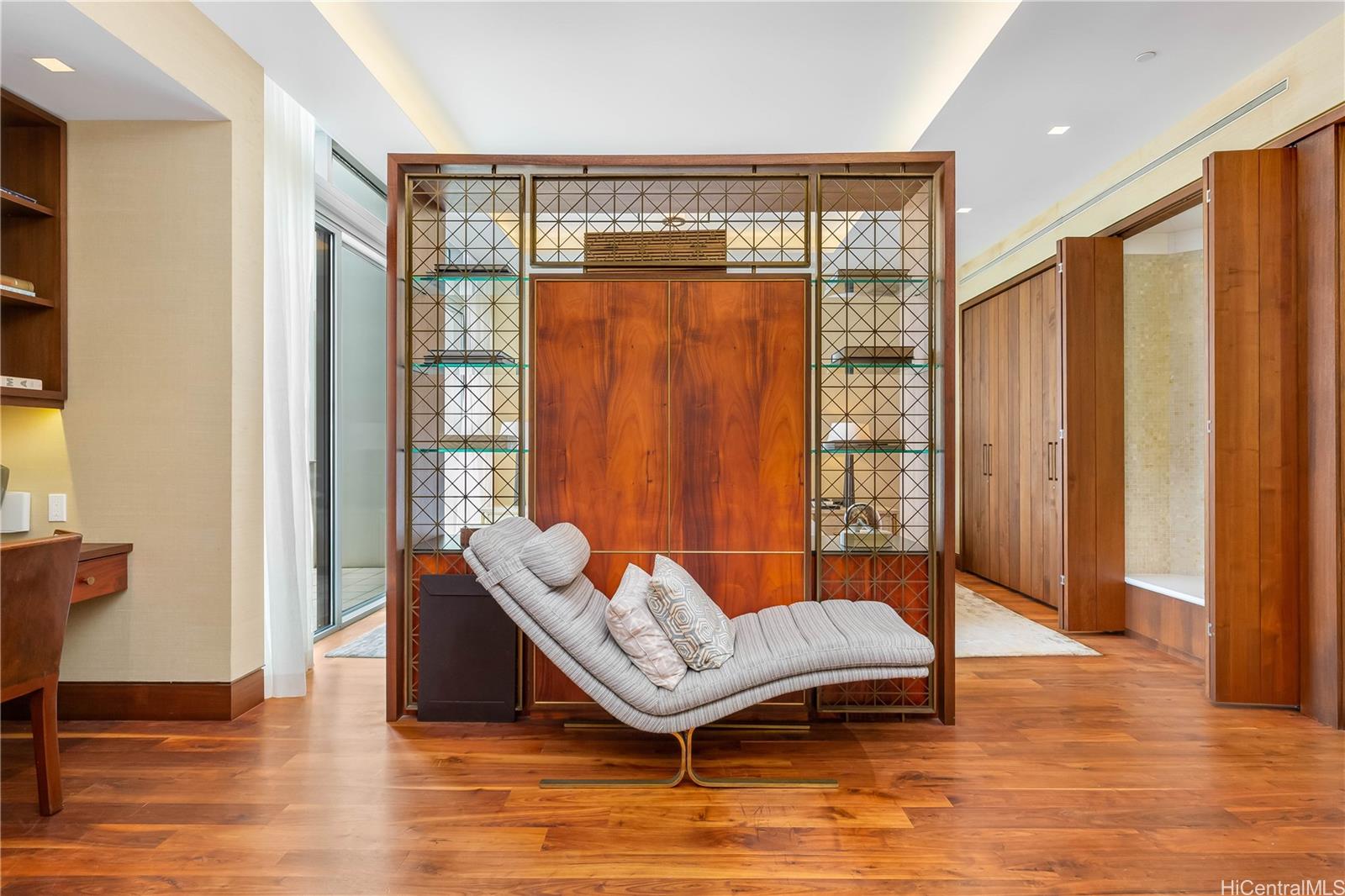 223 Saratoga Road, Unit PHD Honolulu, HI 96815 - Photo 12 of 25 a living room with furniture and wooden floor