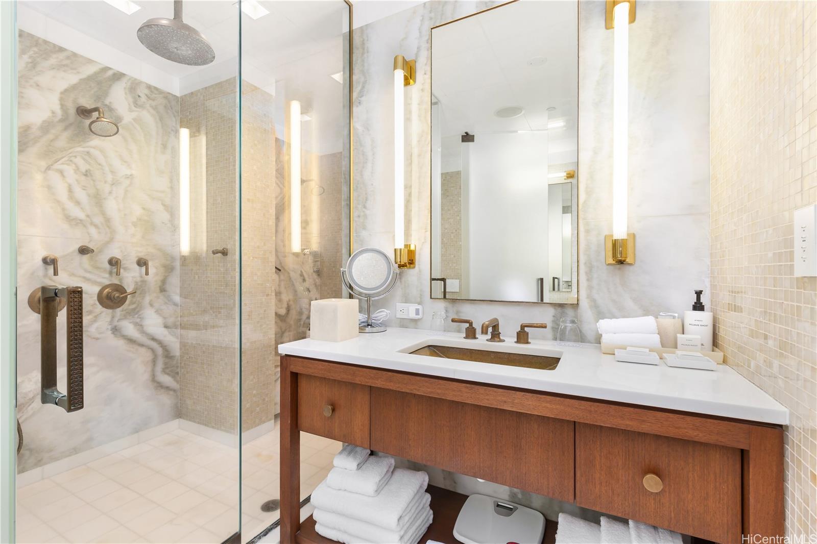 223 Saratoga Road, Unit PHD Honolulu, HI 96815 - Photo 16 of 25 a bathroom with a double vanity sink mirror and shower