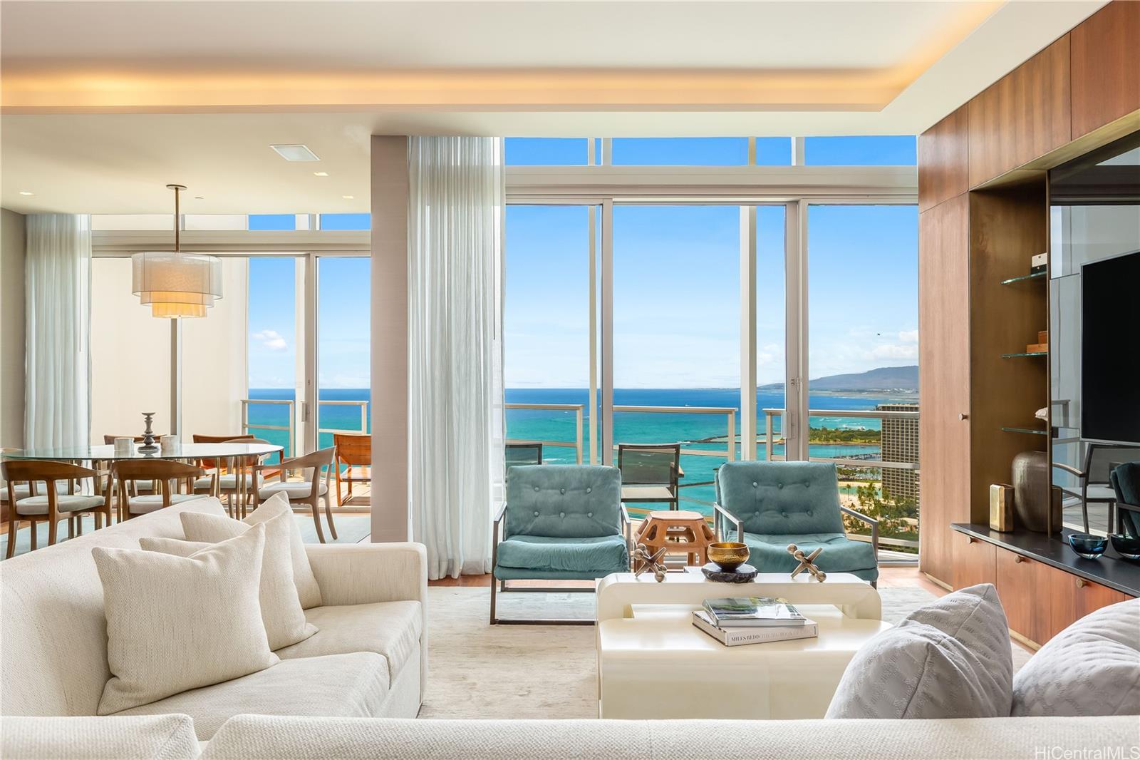 223 Saratoga Road, Unit PHD Honolulu, HI 96815 - Photo 6 of 25 a living room with furniture and floor to ceiling windows