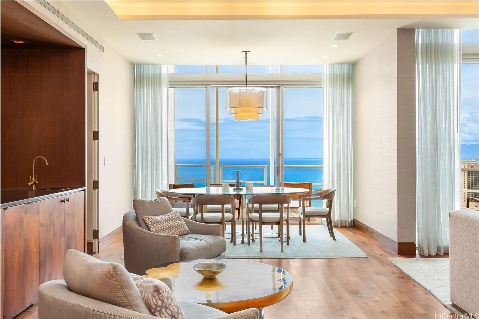 223 Saratoga Road, Unit PHD Honolulu, HI 96815 - Photo 8 of 25 a living room with furniture and a window