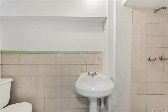 a bathroom with a sink a vanity and a mirror