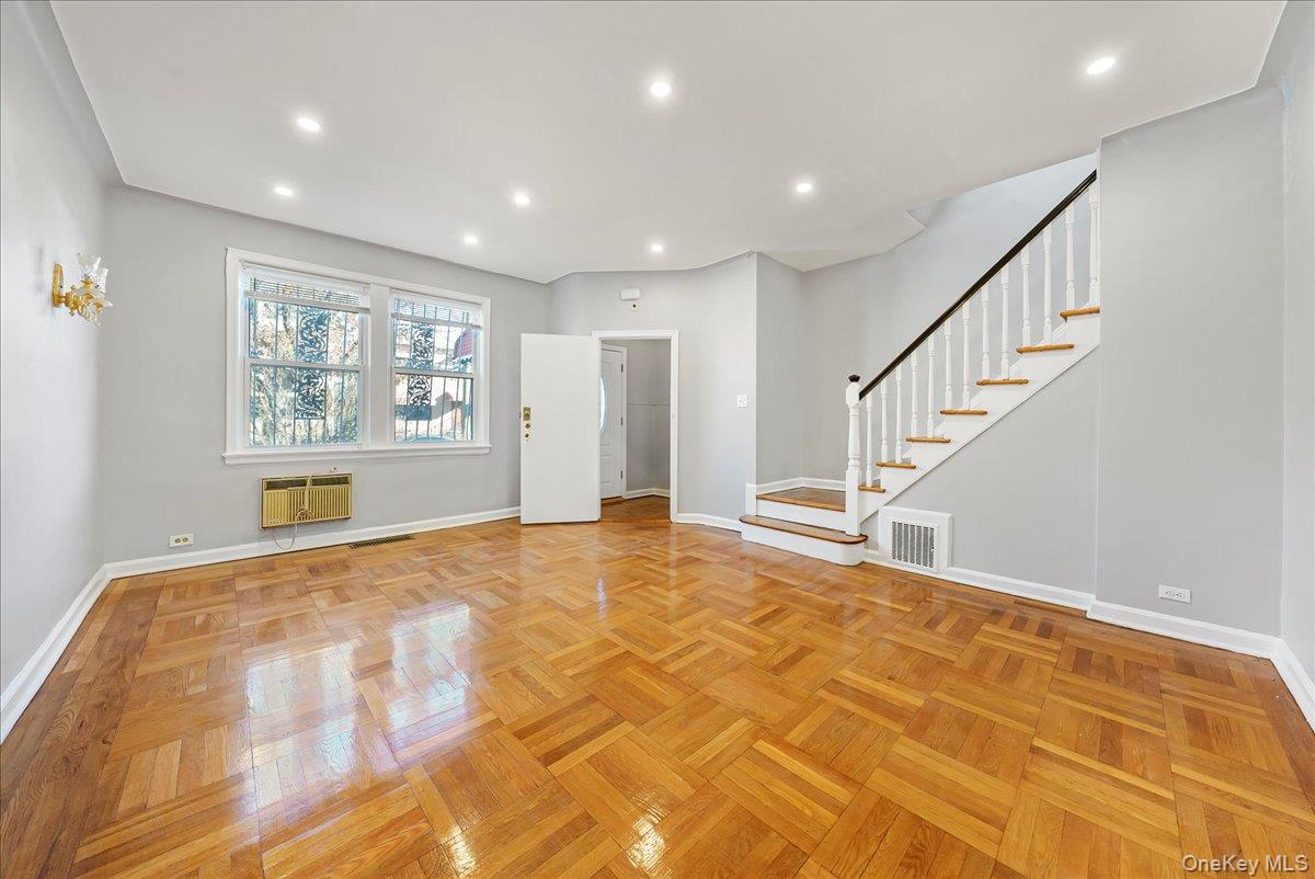4309 Edson Avenue Bronx, NY 10466 - Photo 3 of 26 a view of an empty room with wooden floor and a window