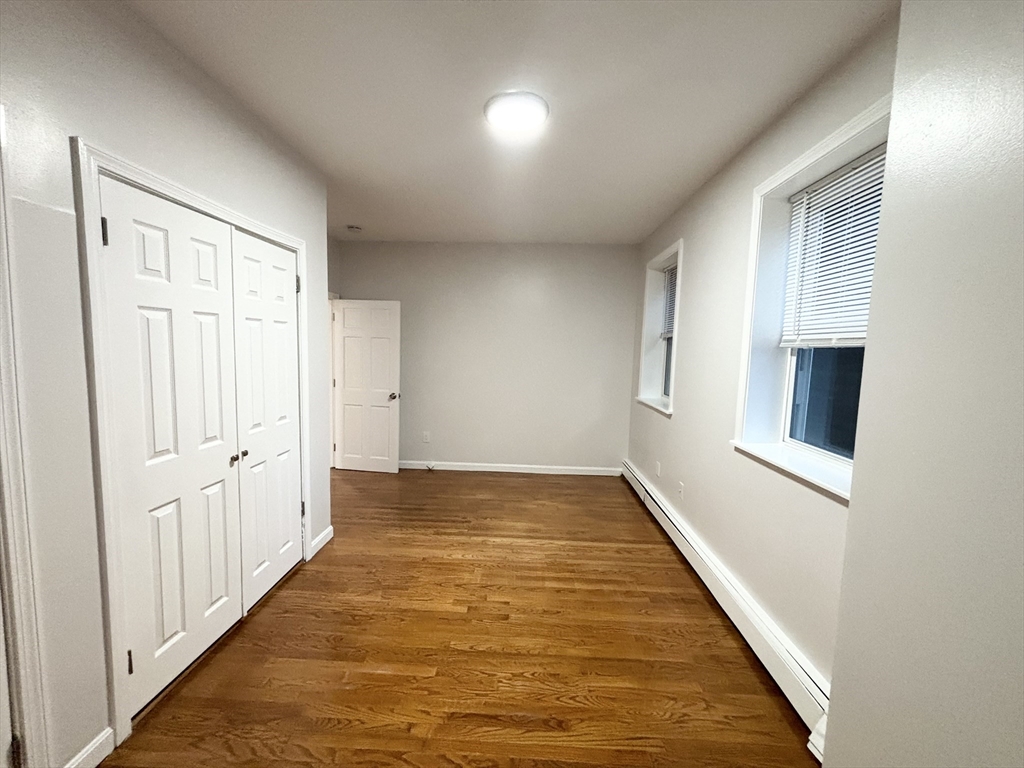 98 Main Street, Unit 1 Malden, MA 02148 - Photo 10 of 15 an empty room with windows