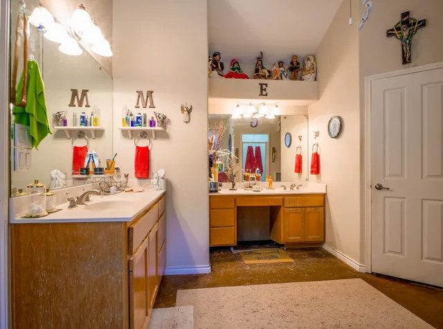 a view of a kitchen sink and wooden floor