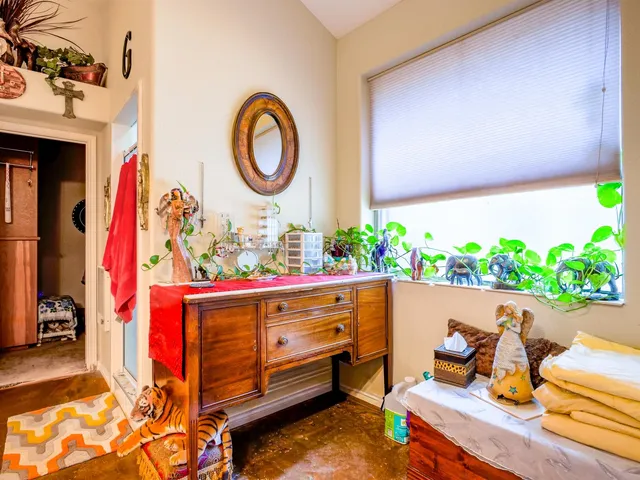 a bedroom with two beds and a chandelier