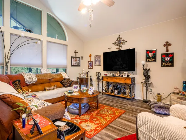a living room with furniture and a flat screen tv