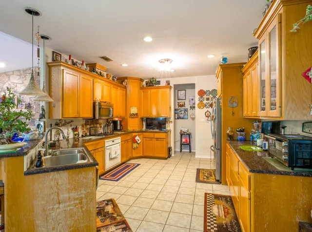a large kitchen with a lot of counter space and a table