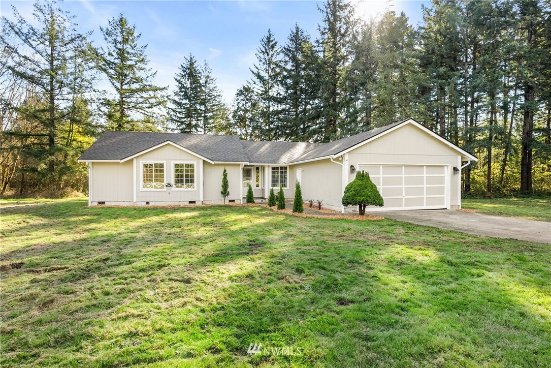 457 Tucker Road Toledo, WA 98591 - Photo 1 of 1 a front view of a house with a yard and trees