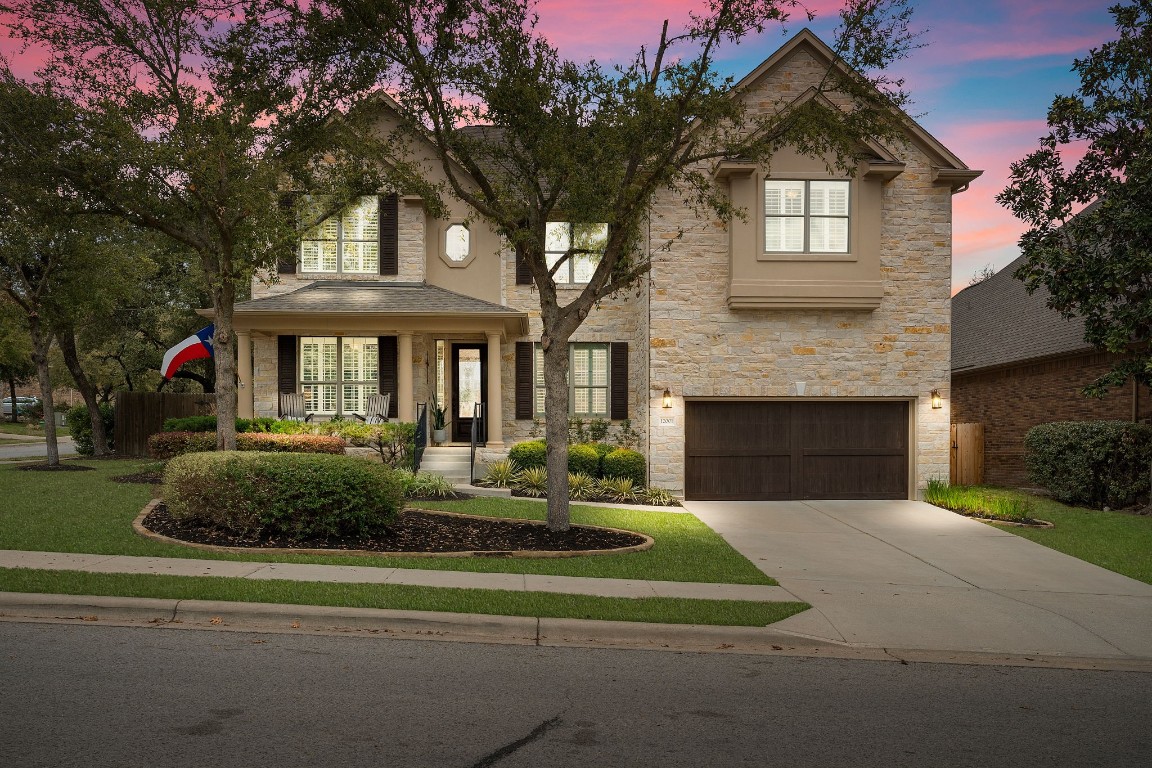 a front view of a house with a yard
