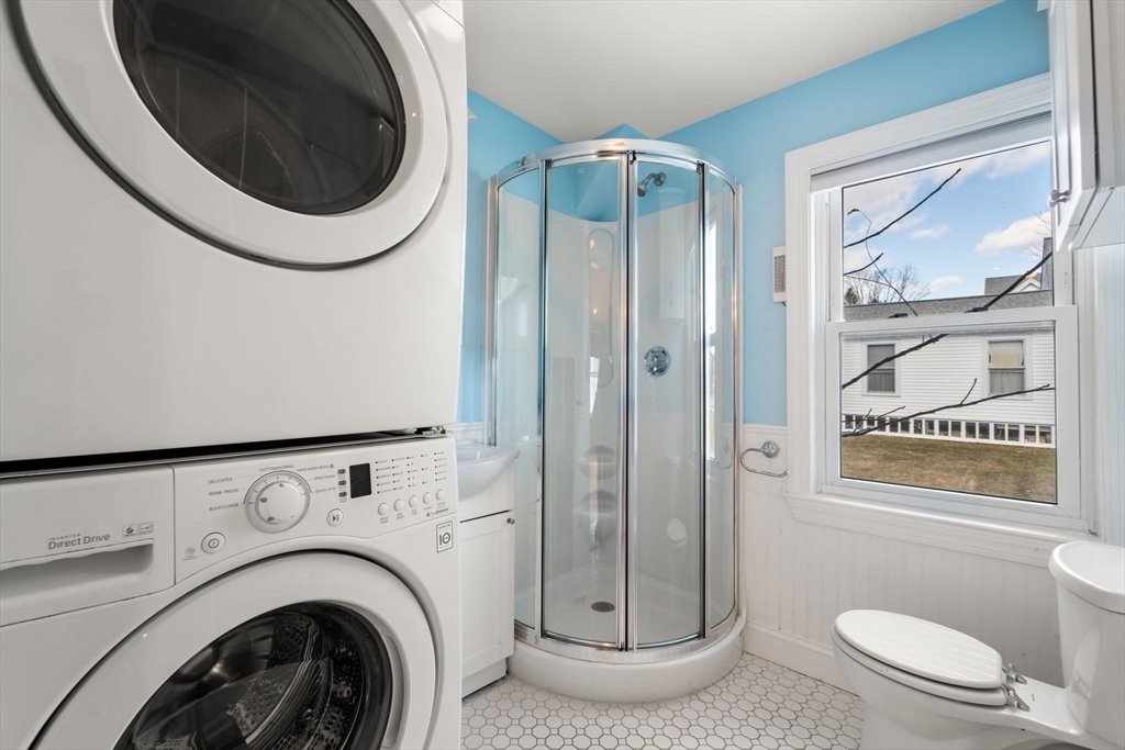 278 North Main Street Natick, MA 01760 - Photo 11 of 28 a bathroom with a toilet a sink and a shower
