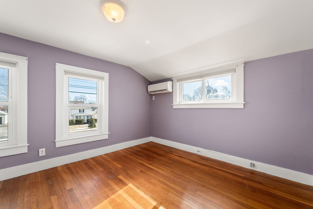 278 North Main Street Natick, MA 01760 - Photo 13 of 28 a view of a room with wooden floor and windows