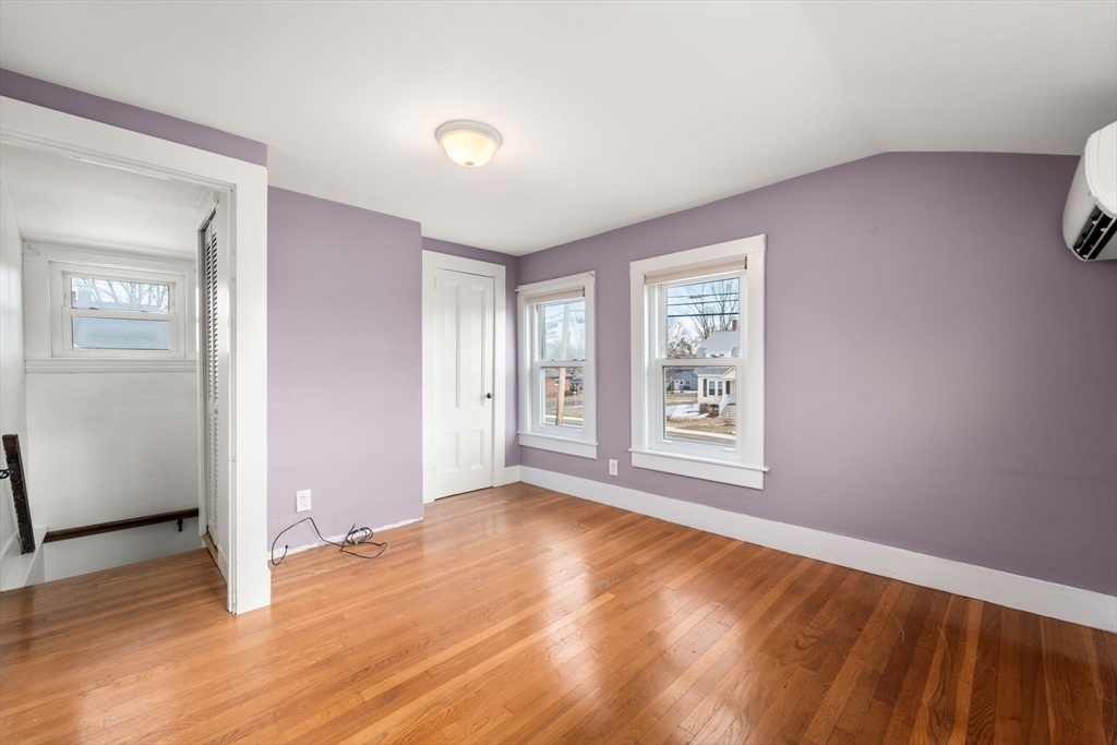 278 North Main Street Natick, MA 01760 - Photo 14 of 28 an empty room with wooden floor and windows