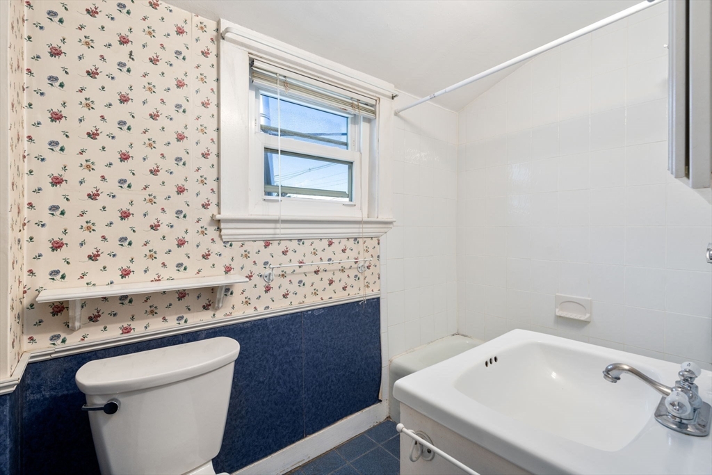 278 North Main Street Natick, MA 01760 - Photo 16 of 28 a bathroom with a sink and a bathtub