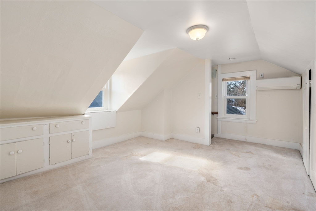 278 North Main Street Natick, MA 01760 - Photo 17 of 28 a view of an empty room with a window