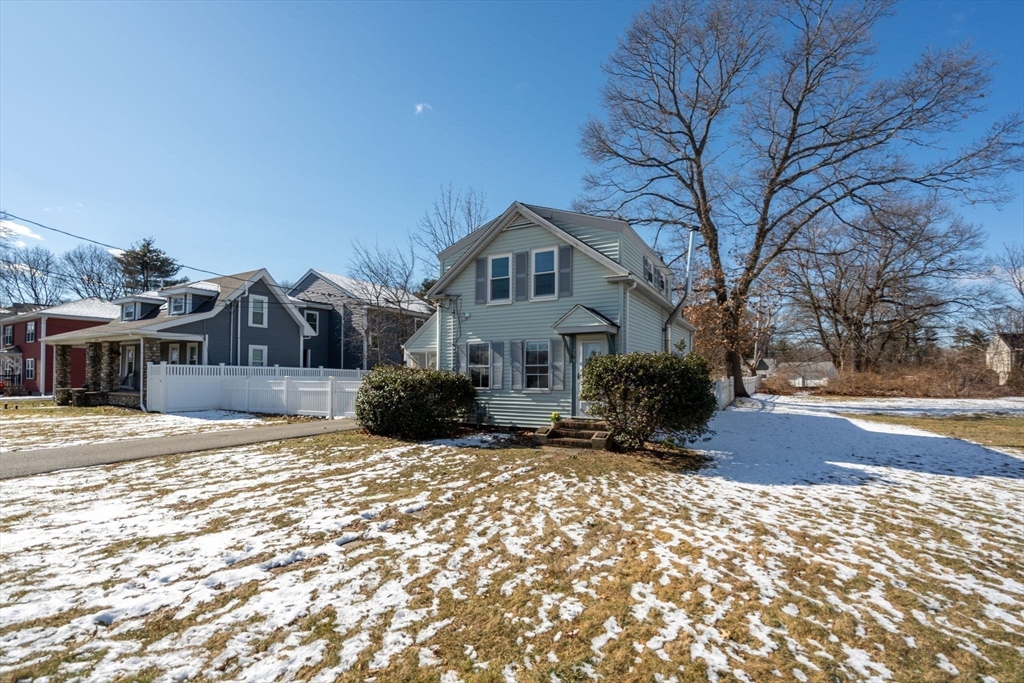278 North Main Street Natick, MA 01760 - Photo 27 of 28 a front view of a house with a yard