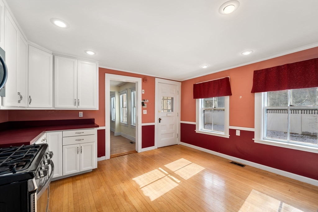 278 North Main Street Natick, MA 01760 - Photo 6 of 28 a kitchen with stainless steel appliances granite countertop a stove and a refrigerator