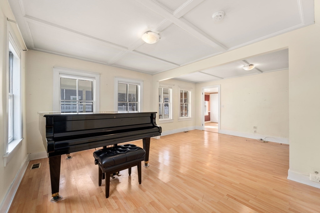 278 North Main Street Natick, MA 01760 - Photo 8 of 28 a room with furniture and a piano