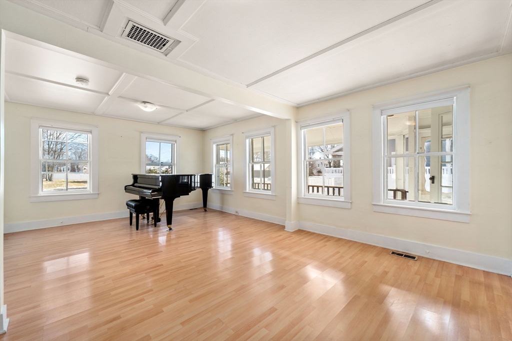 278 North Main Street Natick, MA 01760 - Photo 9 of 28 a view of an empty room with window and wooden floor