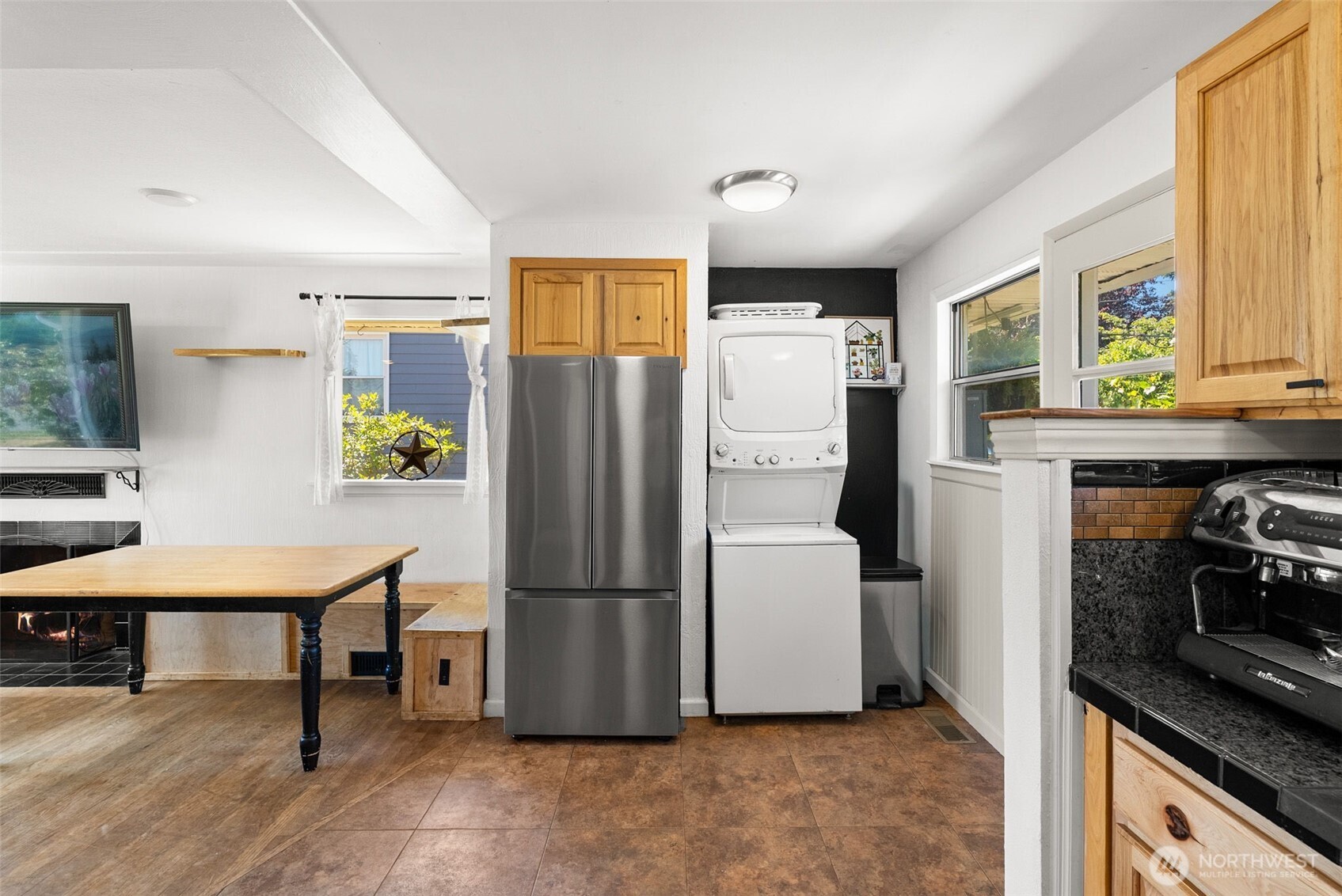 2710 Holman Street Bremerton, WA 98310 - Photo 8 of 25 a kitchen with stainless steel appliances a refrigerator and a stove top oven