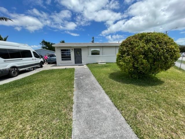 22365 Southwest 112th Court Miami, FL 33170 - Photo 1 of 6 a front view of a house with a garden