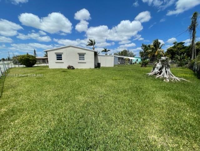 22365 Southwest 112th Court Miami, FL 33170 - Photo 3 of 6 a view of a house with a backyard
