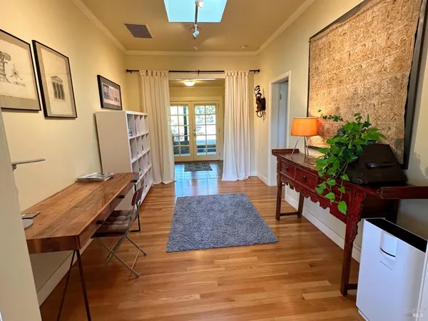 a bedroom with a bed and a mirror