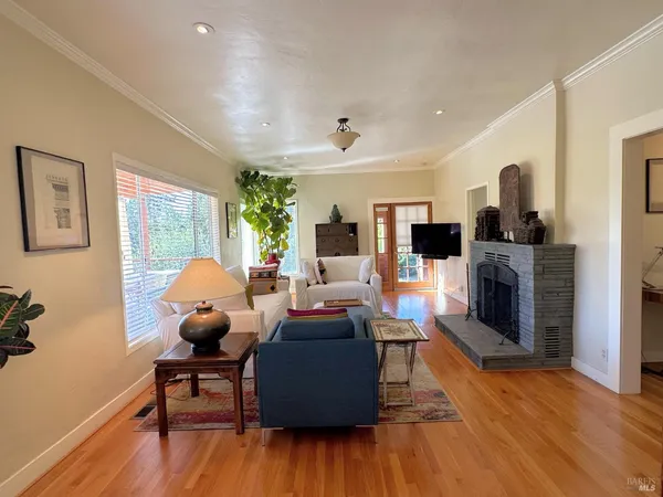 a living room with furniture and a window