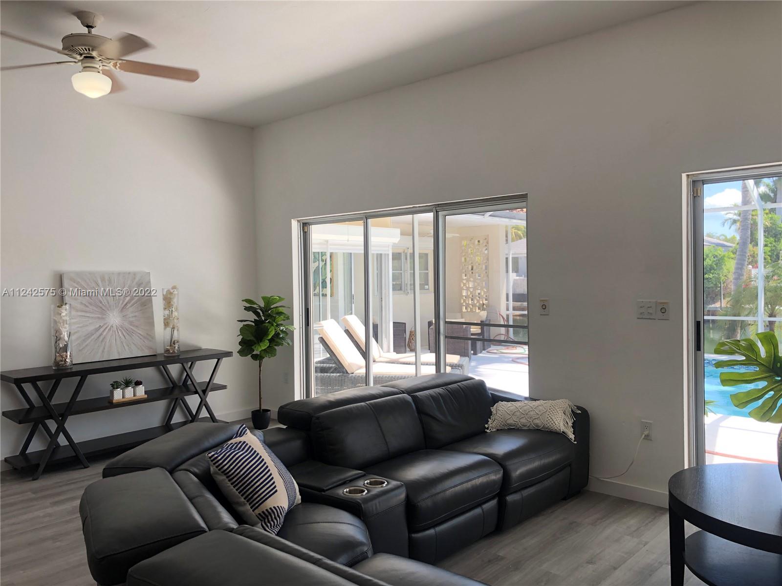 13001 Deva Street Coral Gables, FL 33156 - Photo 18 of 99 a living room with furniture and a window