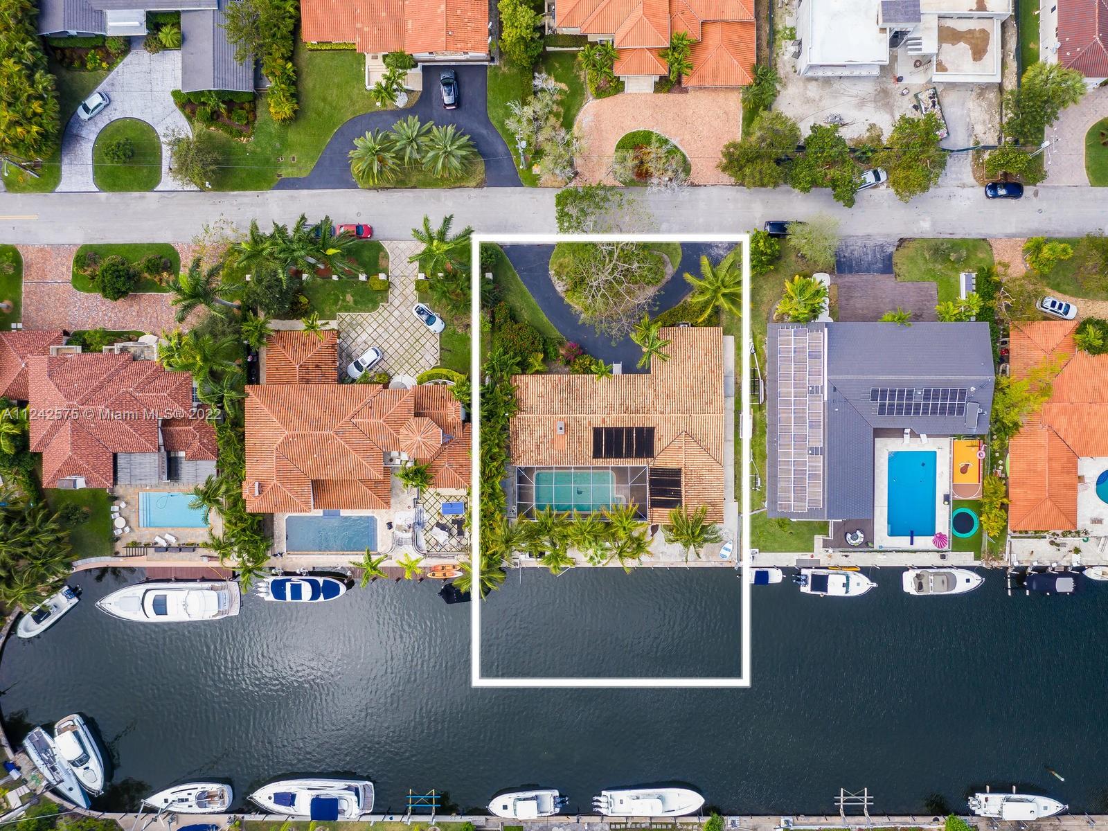 13001 Deva Street Coral Gables, FL 33156 - Photo 2 of 99 an aerial view of residential houses with outdoor space and street view