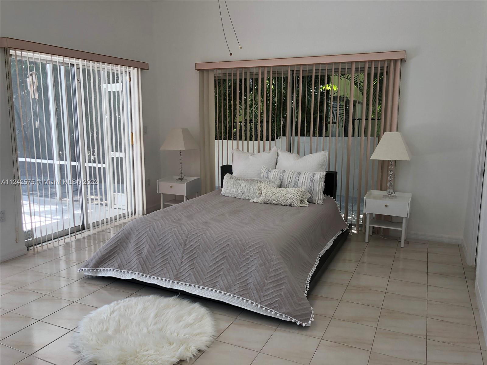 13001 Deva Street Coral Gables, FL 33156 - Photo 37 of 99 a bedroom with a bed and a night stand