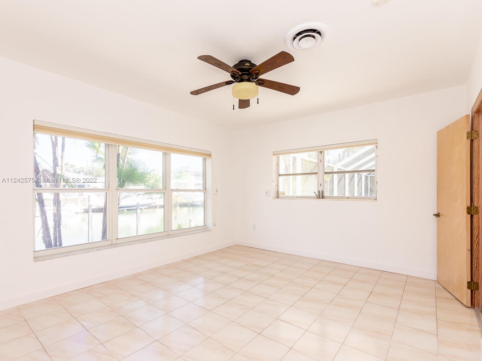 13001 Deva Street Coral Gables, FL 33156 - Photo 50 of 99 a view of an empty room with a window