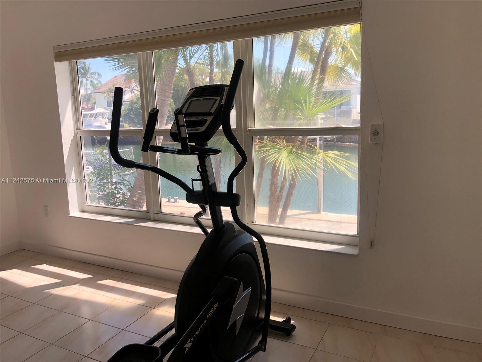 13001 Deva Street Coral Gables, FL 33156 - Photo 59 of 99 a view of a room with furniture and windows