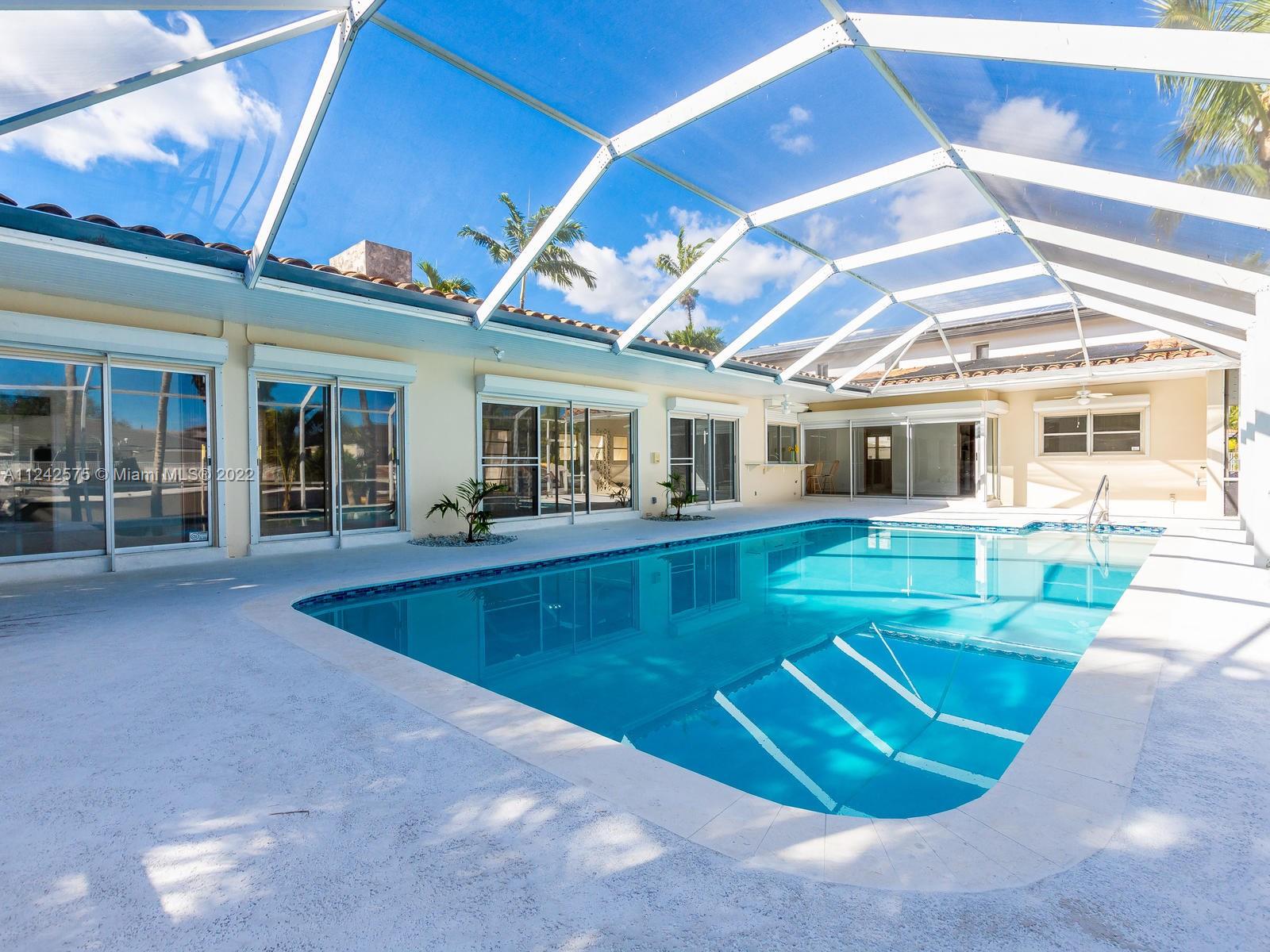 13001 Deva Street Coral Gables, FL 33156 - Photo 68 of 99 a view of a house with a swimming pool