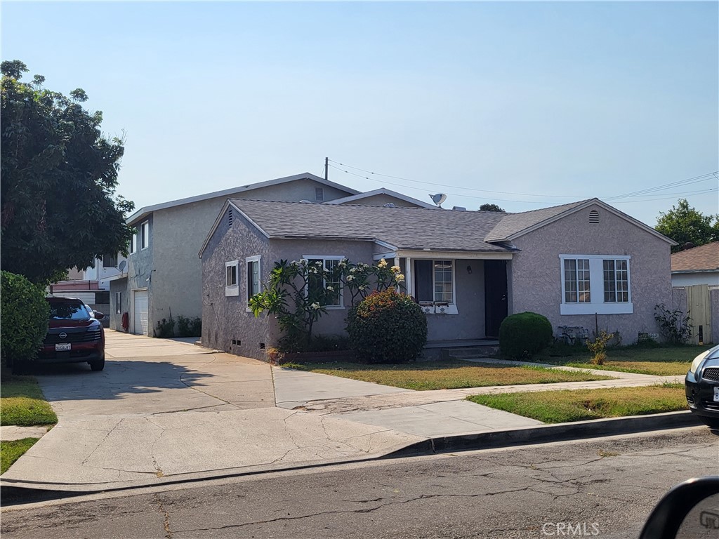 13141 Monroe Street Garden Grove, CA 92844 - Photo 1 of 21 a front view of a house with a yard and garage