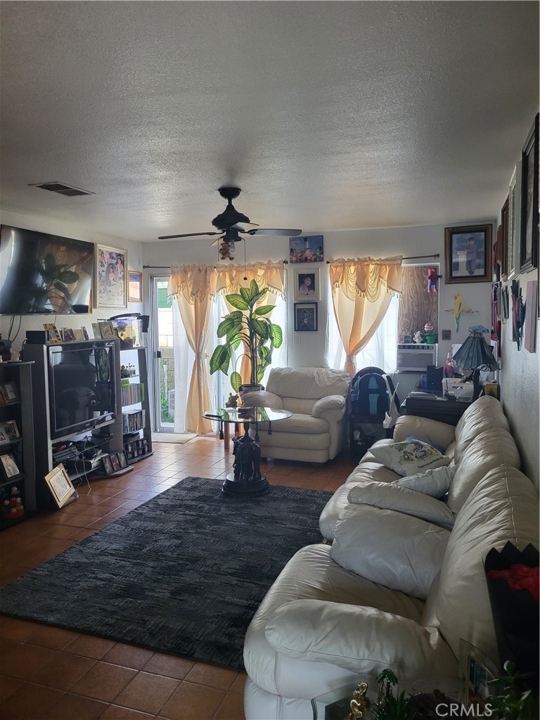 13141 Monroe Street Garden Grove, CA 92844 - Photo 12 of 21 a living room with furniture and a large window