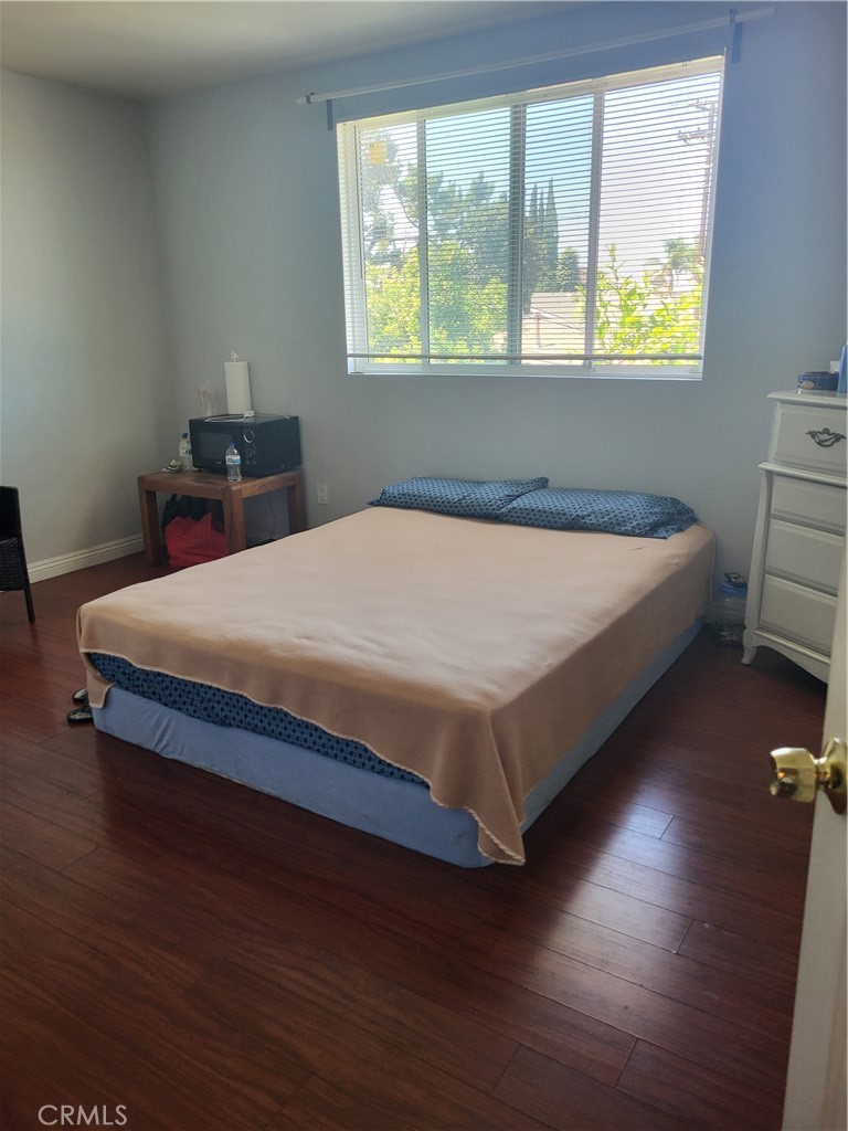 13141 Monroe Street Garden Grove, CA 92844 - Photo 15 of 21 a bed sitting in a bedroom next to a window