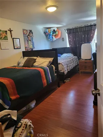 a bedroom with bed and window