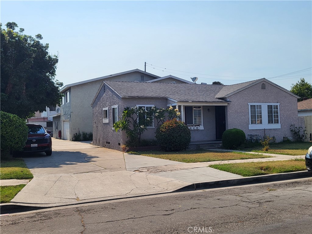 13141 Monroe Street Garden Grove, CA 92844 - Photo 3 of 21 a view of a house with swimming pool and a yard