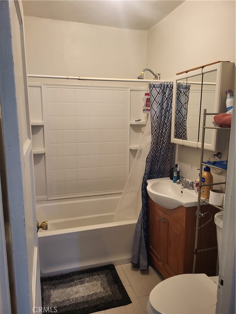 13141 Monroe Street Garden Grove, CA 92844 - Photo 5 of 21 a bathroom with a toilet and a shower