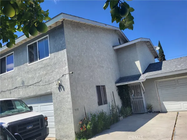 a side view of a house with a garage