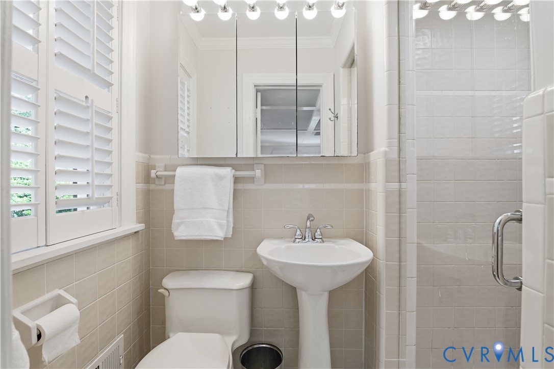 6405 Buckhill Road Richmond, VA 23225 - Photo 23 of 71 Pedestal sink with chrome fixtures, mirrored medic