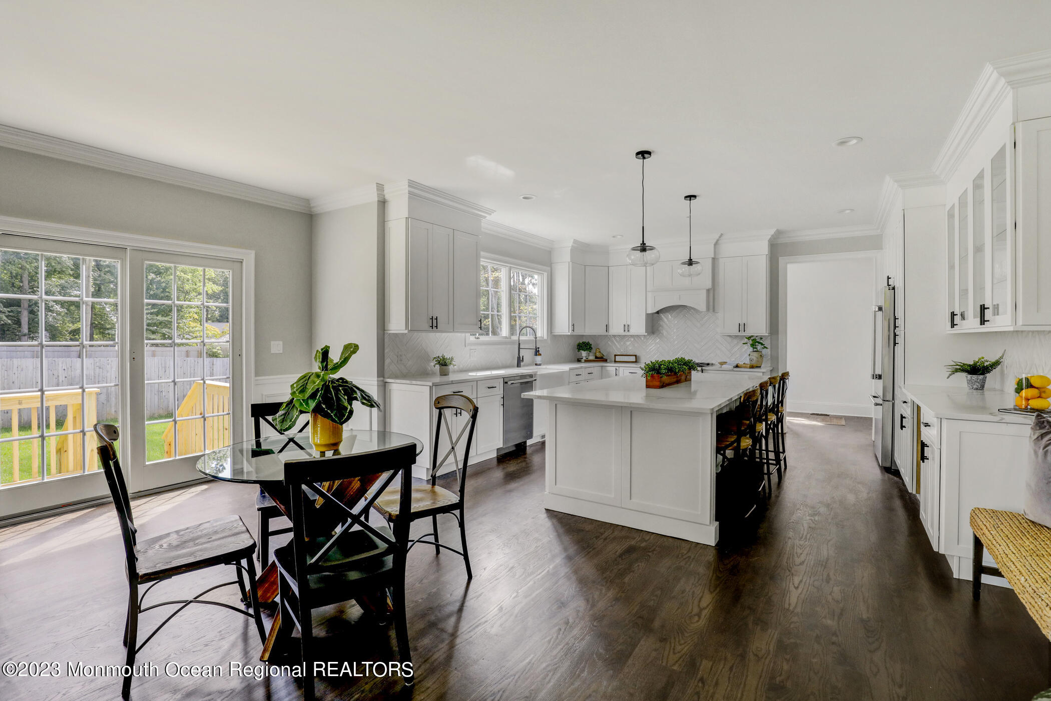 4 Southall Lane Red Bank, NJ 07701 - Photo 12 of 41 a kitchen with a table chairs stove and white cabinets