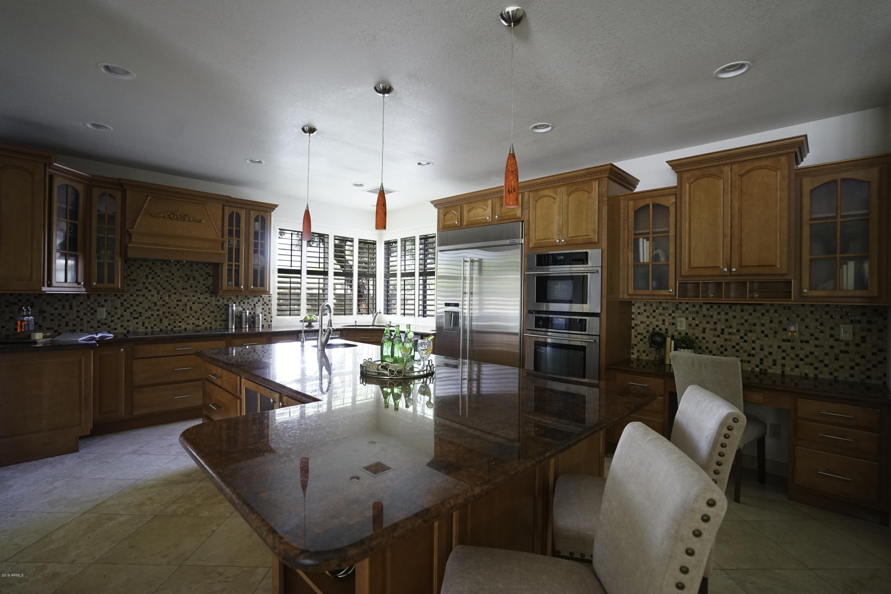 1225 East Warner Road, Unit 6 Tempe, AZ 85284 - Photo 1 of 86 a dining room with furniture wooden floor and a kitchen view
