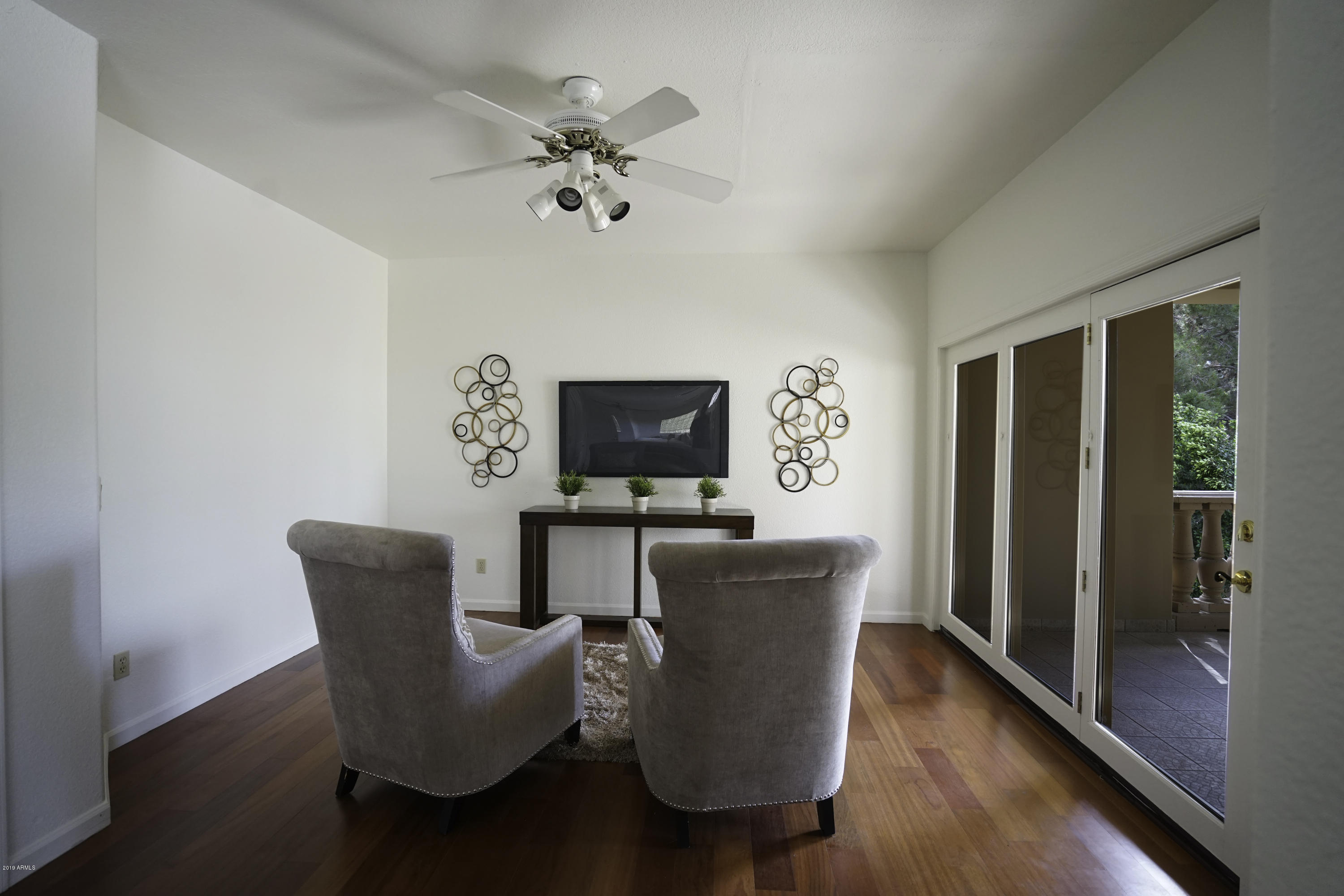 1225 East Warner Road, Unit 6 Tempe, AZ 85284 - Photo 26 of 86 a living room with furniture and a flat screen tv