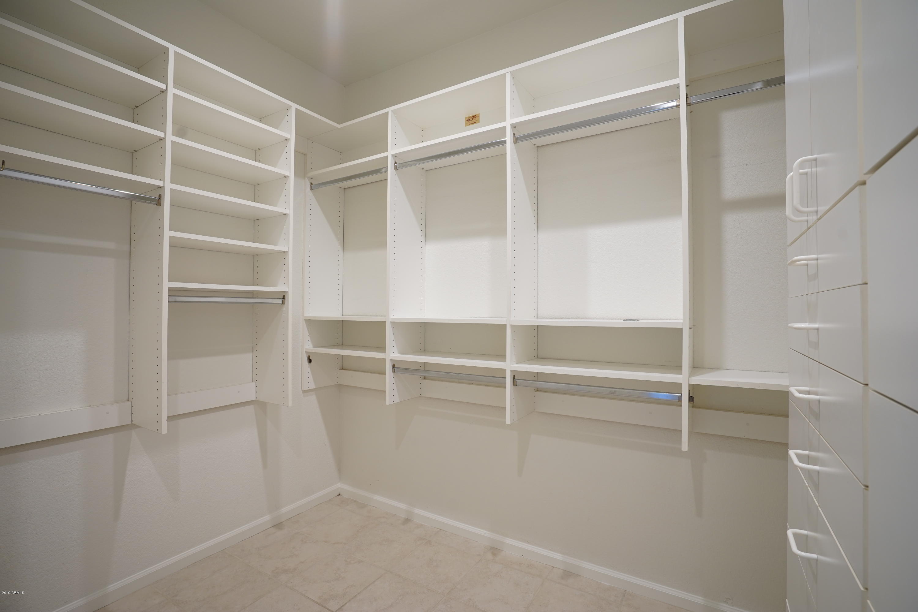 1225 East Warner Road, Unit 6 Tempe, AZ 85284 - Photo 34 of 86 a view of an empty walk in closet