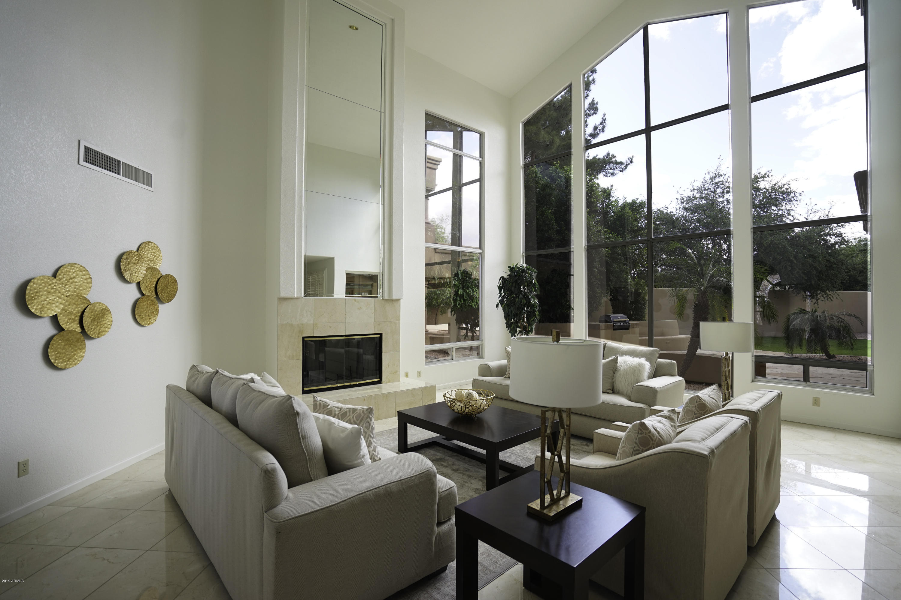 1225 East Warner Road, Unit 6 Tempe, AZ 85284 - Photo 5 of 86 a living room with furniture and a floor to ceiling window